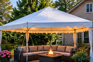 Backyard tent over a patio with a fire table and seating