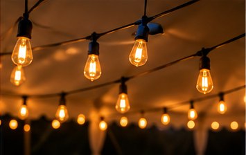 Warm string lights glowing at night